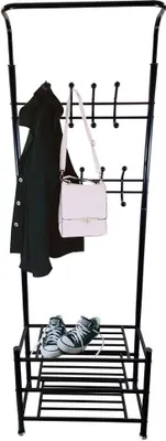 A black metal coat rack with a coat, a handbag, and shoes on it.