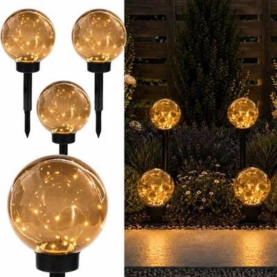 Obrázek produktu pro Sada 4 solárních zahradních světel LUMILED, LED koule, kouřově šedá barva, 20 cm. Solární lampa, světlo pro cestu, model GLORIS, IP44. Solární koule pro zahradu a venkovní použití, osvětlovací koule, 3000K, teplá bílá barva, kouřová barva, s kolíkem pro zapíchnutí do země. Venkovní světlo, světlo pro cestu