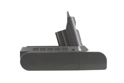A side view of a black and gray vacuum cleaner battery pack against a white background.