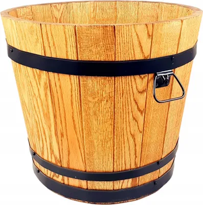 A wooden barrel-shaped planter with black metal bands.