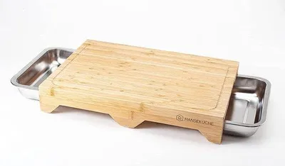 Produktbild von Unyqoos® Hanseküche XL Bambus-Schneidebrett mit Saftrinne, 3 integrierte Auffangschalen aus Edelstahl, 3 cm stabile Füße, messerfreundlich