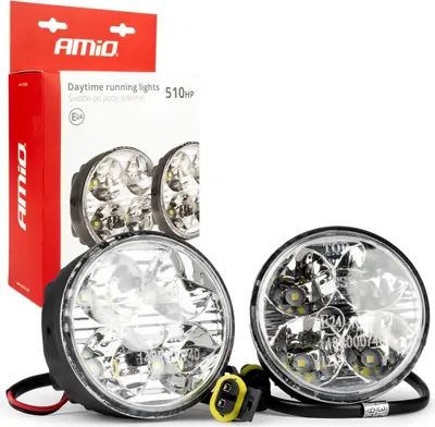 Two round LED daytime running lights with their packaging.