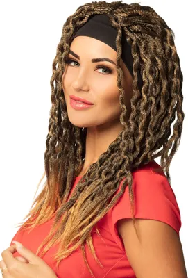 A woman wearing a red shirt and a black headband, with long, braided dreadlock-style hair extensions.