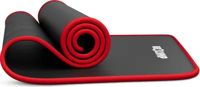 A rolled-up black fitness mat with red trim, partially unrolled on a white background.