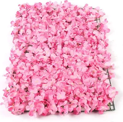A close-up, top-down view of a panel covered in artificial pink flowers.
