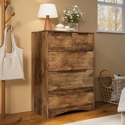 A dresser with drawers is shown next to a coat rack with a bag and a lamp on top.