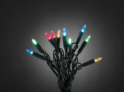 A bunch of colorful LED Christmas lights on a dark background.