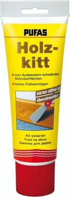 A tube of wood filler with product information and an image of the product being applied.