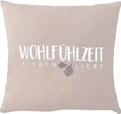 A pillow with text and an image of pine cones.