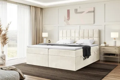 A bedroom scene with a bed as the main focus, natural light coming from a large window.