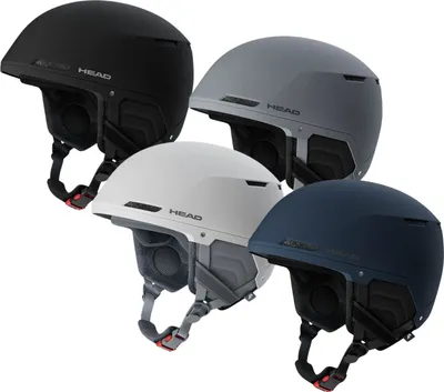 Four ski helmets in different colors arranged in a group.