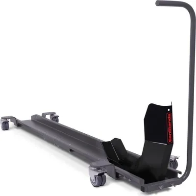 A gray motorcycle mover with a black wheel chock and a handle, shown on a white background.