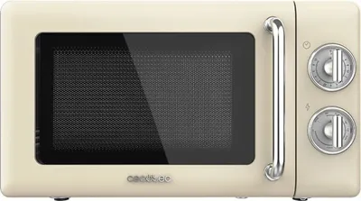 A studio shot of a retro-style beige microwave oven.