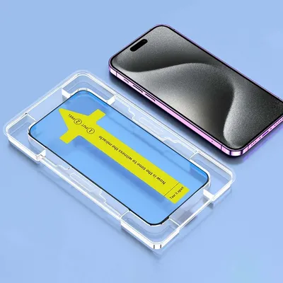 A smartphone screen protector being applied using an alignment tool, with a smartphone in the background.