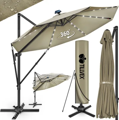 A display of a large cantilever umbrella, its cover, and a folded umbrella.