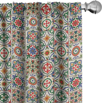 A close-up view of a curtain with a colorful tile pattern.