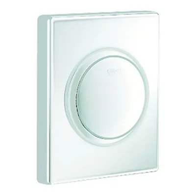A close-up studio shot of a white urinal flush plate.