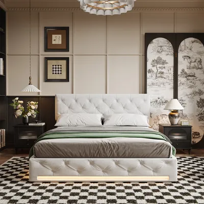 A bedroom scene featuring a tufted white bed with green and gray bedding, set against a paneled wall with artwork and a decorative screen. Nightstands with lamps flank the bed, and a checkered rug lies on the floor.