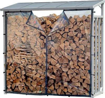 A metal firewood rack filled with logs, covered by a clear protective tarp.