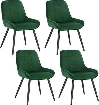 Four dark green upholstered dining chairs are arranged in a two-by-two grid against a white background.