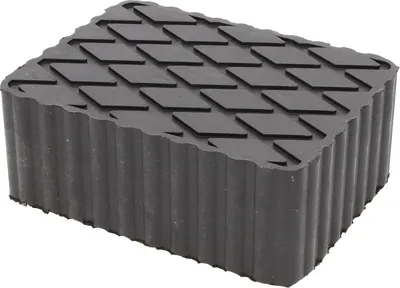 A black rubber jack pad with a diamond pattern on top and ribbed sides, isolated on a white background.