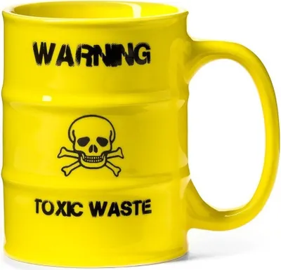 A yellow mug designed to look like a toxic waste barrel.