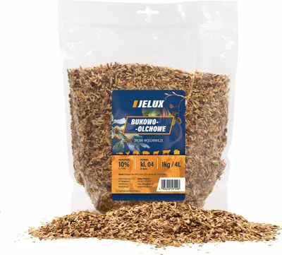 A bag of wood chips for smoking, with some chips spilled in front.