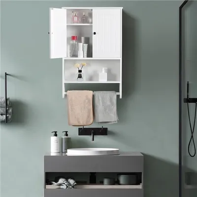 A bathroom scene with a wall-mounted cabinet, sink, and shower.