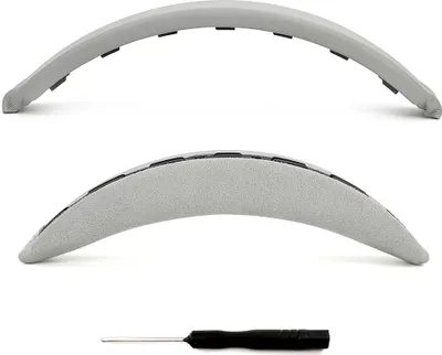 Two views of a gray headphone headband cushion and a small screwdriver.