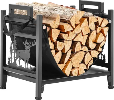 A metal firewood rack filled with logs, featuring a decorative silhouette of a deer and trees on one side.