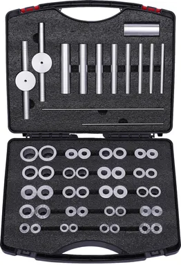 A black case containing a bicycle bearing press kit.
