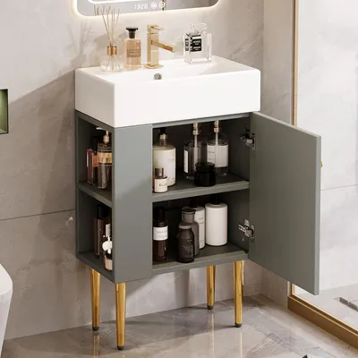 A bathroom vanity with a sink and storage cabinet.