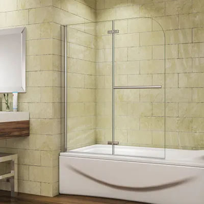 A modern bathroom with a bathtub and a glass shower screen.