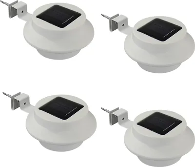 Four white solar-powered gutter lights are arranged in a two-by-two grid against a white background.