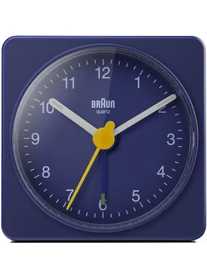 A close-up studio shot of a blue Braun alarm clock.