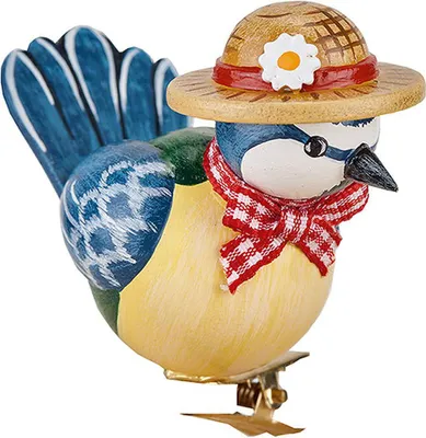 A wooden figurine of a blue tit bird wearing a straw hat and a red and white checkered scarf, attached to a clip.