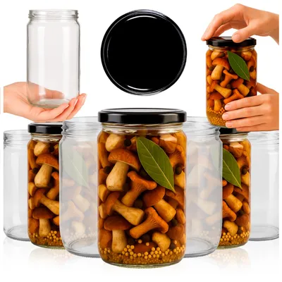Several glass jars filled with pickled mushrooms and bay leaves, with an empty jar and a lid shown separately.