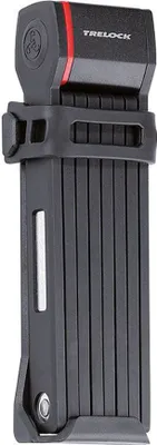 A black folding bicycle lock with red accents and the brand name TRELOCK visible.