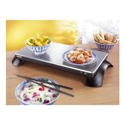 A warming tray with various Asian-inspired dishes, including shrimp, wontons, spring rolls, and noodles, arranged on a wooden table.