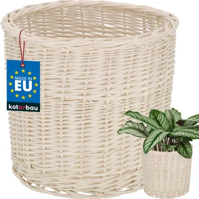 A white woven basket with a plant in a smaller woven pot placed in front of it.