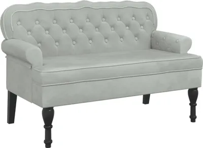 A light gray velvet sofa with tufted backrest and dark wooden legs, shown against a white background.