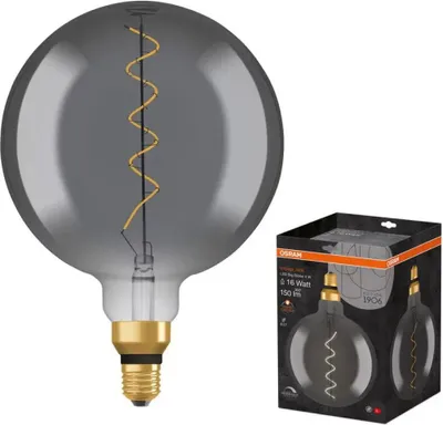 A large, globe-shaped LED light bulb with a visible filament, shown next to its retail packaging.