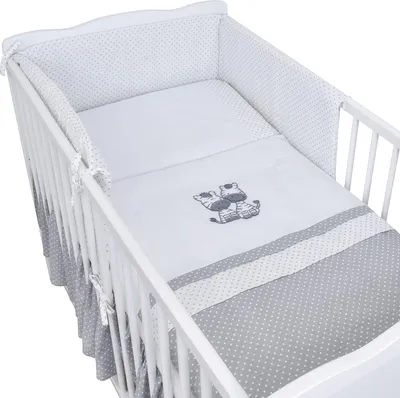 A baby crib with bedding set.