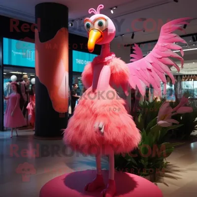 Produktbild von Rosafarbener REDBROKOLY Flamingo Maskottchen Kostüm charakter bekleidet mit einem Kleid und Haarnadeln