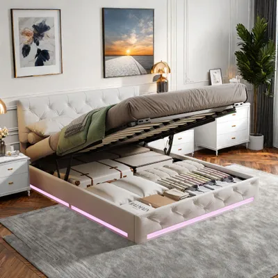 A bedroom scene with a bed that has its storage compartment open, revealing stored items. The bed has LED lighting around its base.