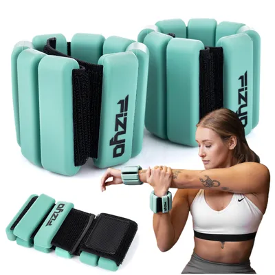 A woman is shown wearing wrist weights while stretching her arm.
