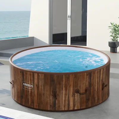 Produktbild von AREBOS nafukovací vířivka, In & Outdoor, pro 7 osob, ⌀ 180 cm,130 bublinkových lázní a wellness masážních trysek, s ohřevem do 40 °C, 1120 litrů, vzhled dřeva