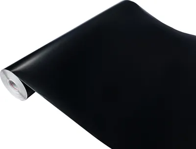 A roll of black matte adhesive film, partially unrolled.
