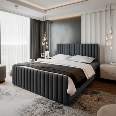 A modern bedroom with a large upholstered bed as the focal point.