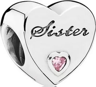 A close-up studio shot of a silver heart-shaped charm with the word "Sister" engraved on it and a small pink gemstone.